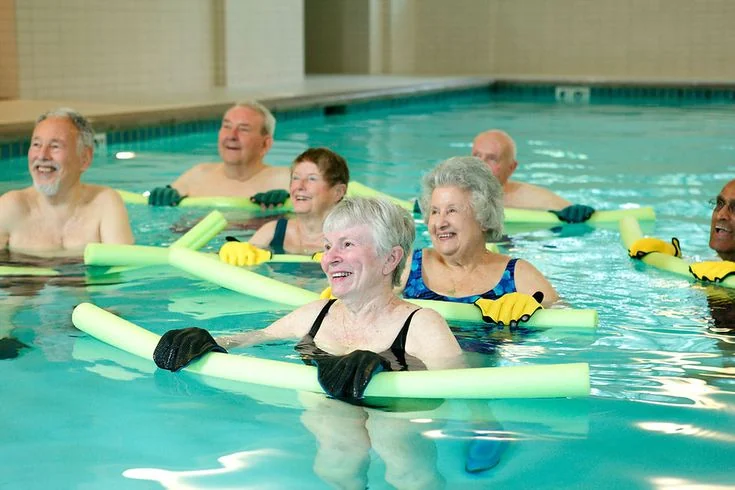 A group enjoying exercise together in the pool