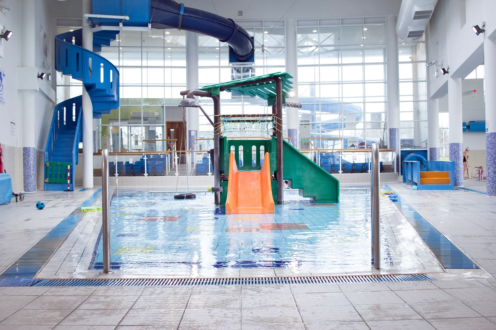 Colourful slides and reflections in Churchfield's family pool