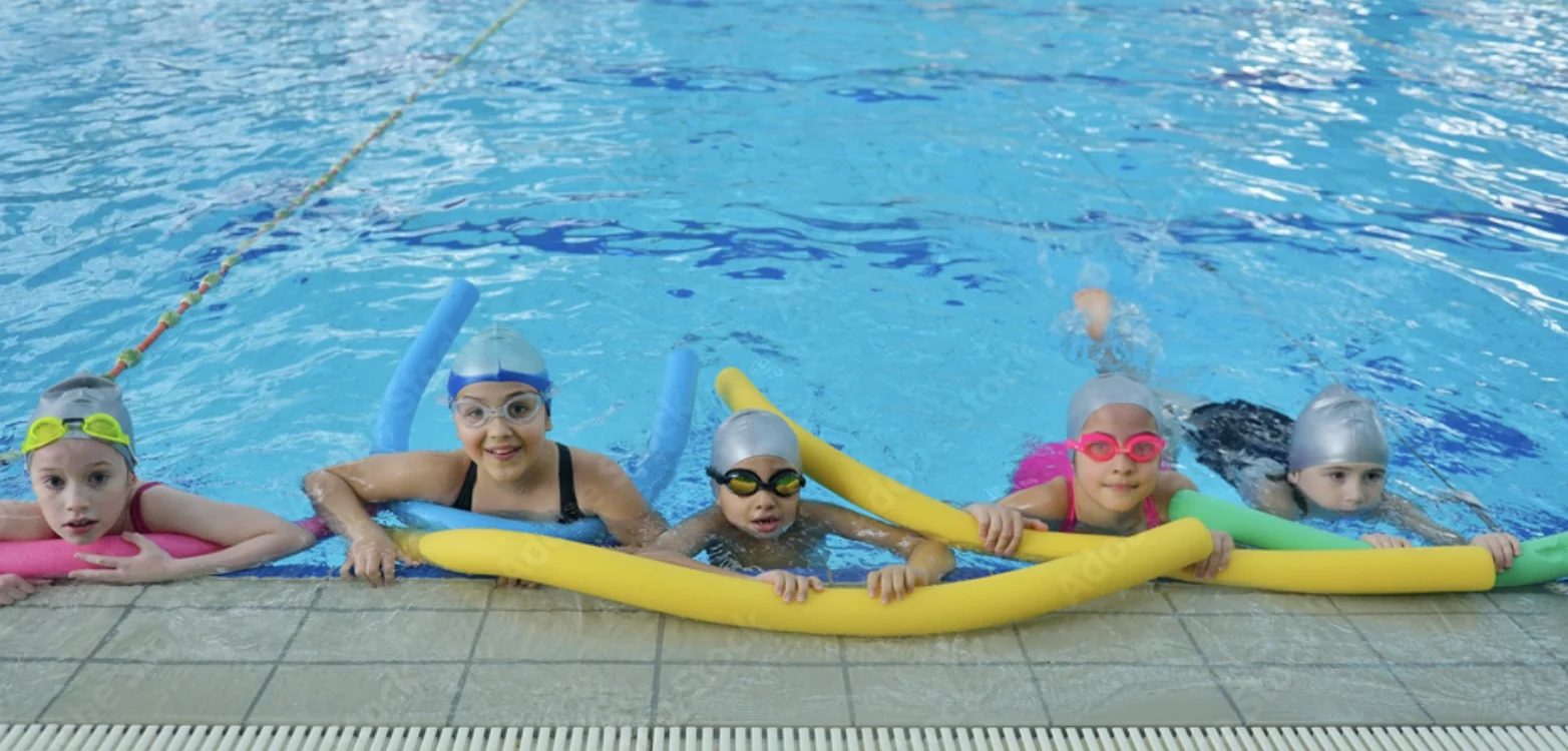 Young swimmers enjoying time together in the pool